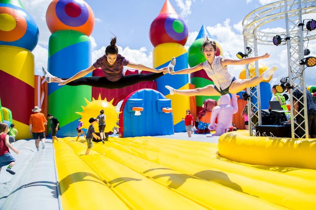 kids jumping on an inflatable castle at the big bounce