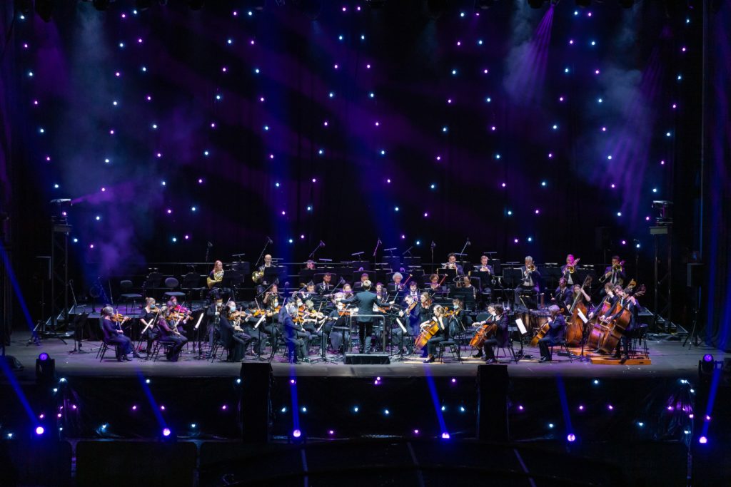 a live orchestra performing on stage