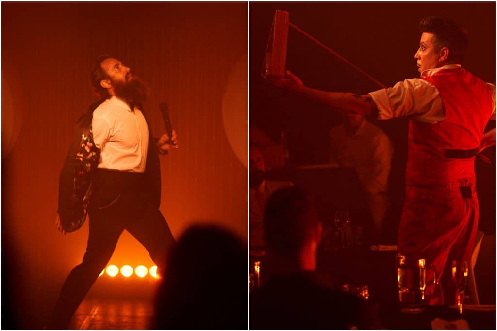 male performer in process of taking off jacket and another male performer beginning a balance routine with what appears to be a pool stick and cue