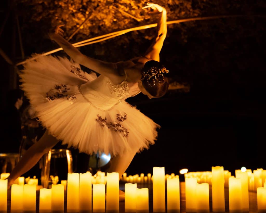 ballerina surrounded by candles
