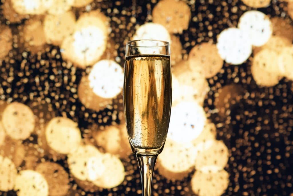 glass of champagne, golden background