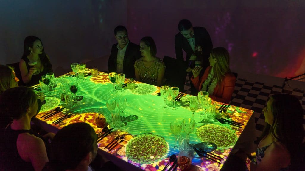 image of video mapping on table during immersive dining experience
