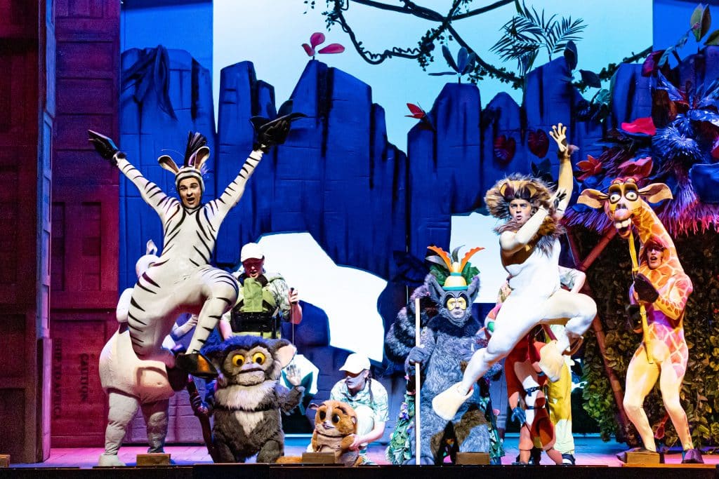 performers dressed up as characters from the movie for madagascar the musical