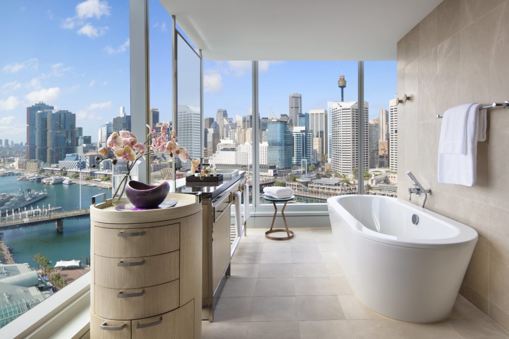 a bathroom in sofitel sydney overlooking darling harbour
