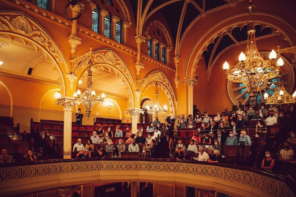 audience seated in the great synagogue in sydney waiting for performance to begin