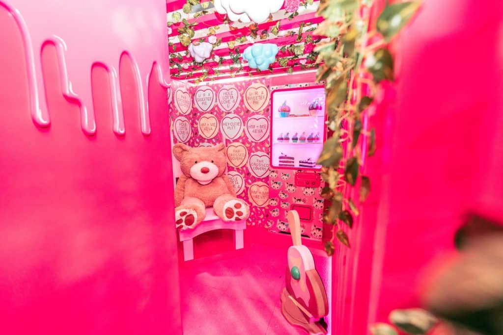 a pink themed room at a mini golf venue