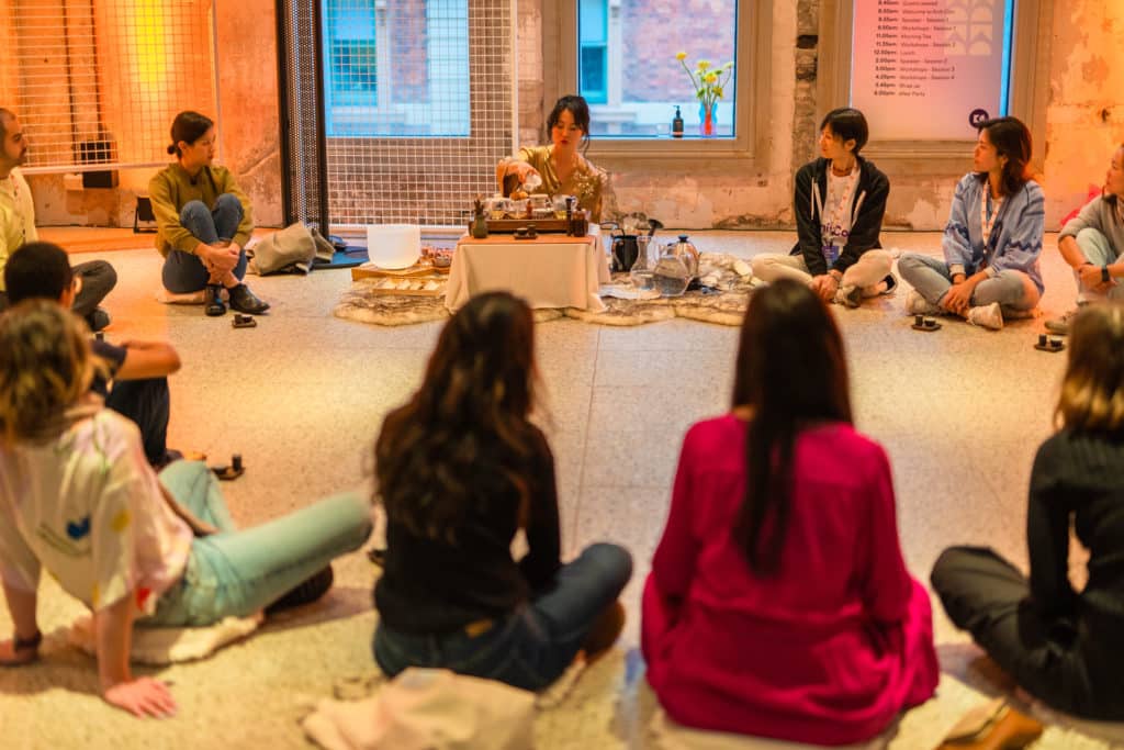 young women sitting in a circle at a tea ceremony in Sydney