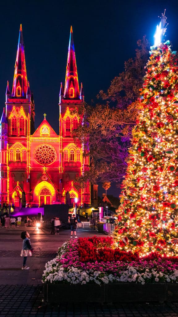 St. Mary's Cathedral illuminated by the Lights of Christmas light projection in Sydney.