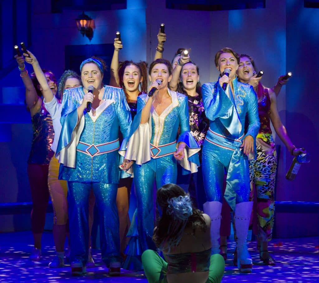 performers on stage for mamma mia! the musical