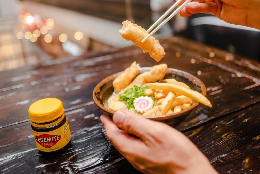 vegemite ramen topped with fish and chips 