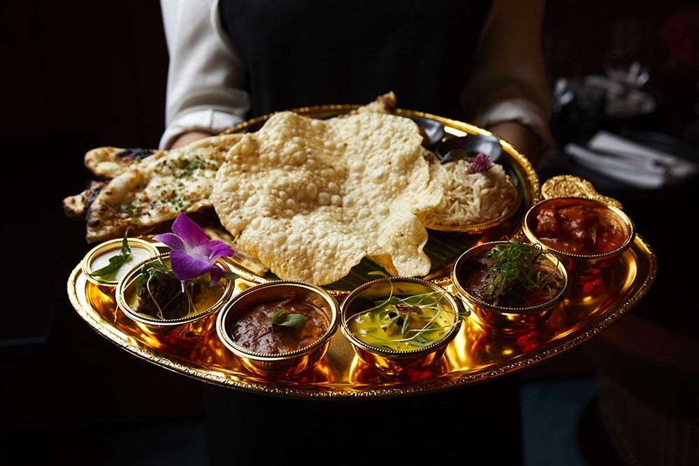 a plate with traditional Indian food