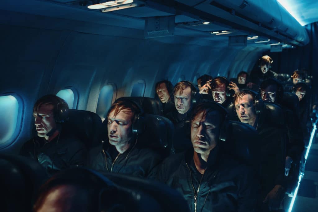 a plane cabin full of people 