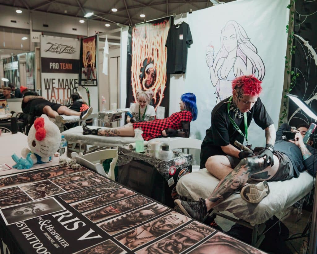 people getting tattoos at the Australian Tattoo Expo