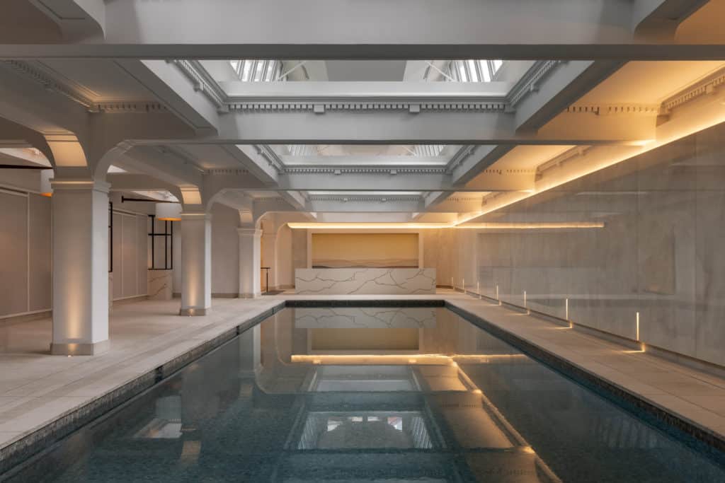 an indoor swimming pool in capella sydney hotel