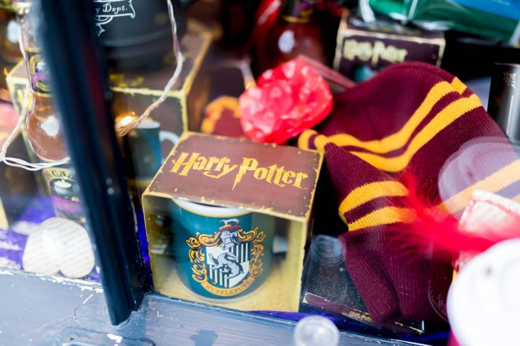 The Shambles, York 16th February 2018. J K Rowlings Harry Potter merchandise including a mug and hat in the Harry Potter platform nine and three quarters shop in the Shambles in Yorks, UK