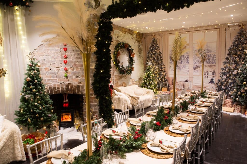 a dining room decked out with christmas decorations