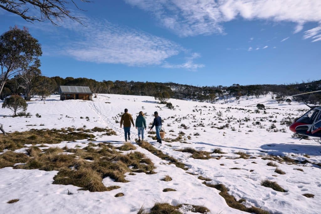 people walking on a snowy mountain