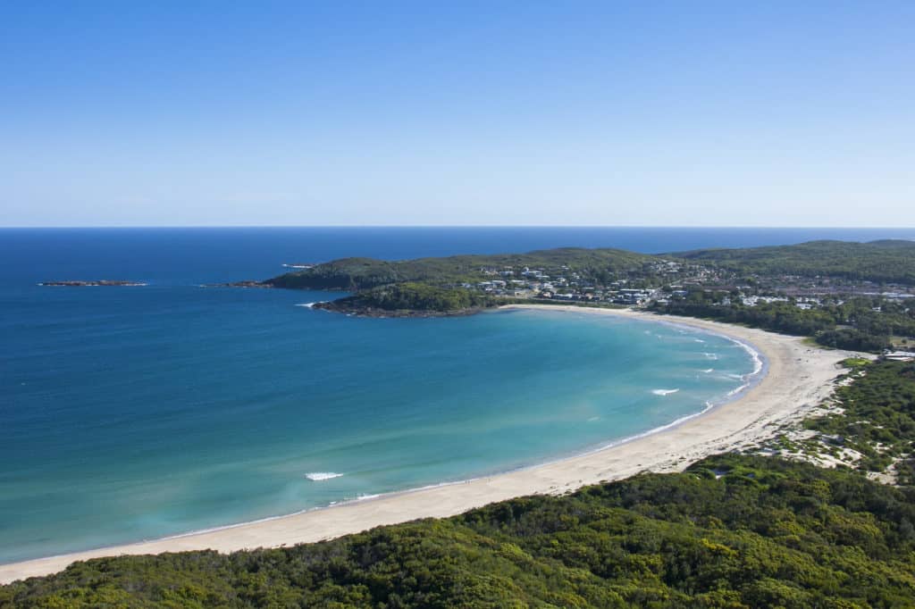 Coastal aerial view of Fingal Beach in Fingal Bay, Port Stephens.