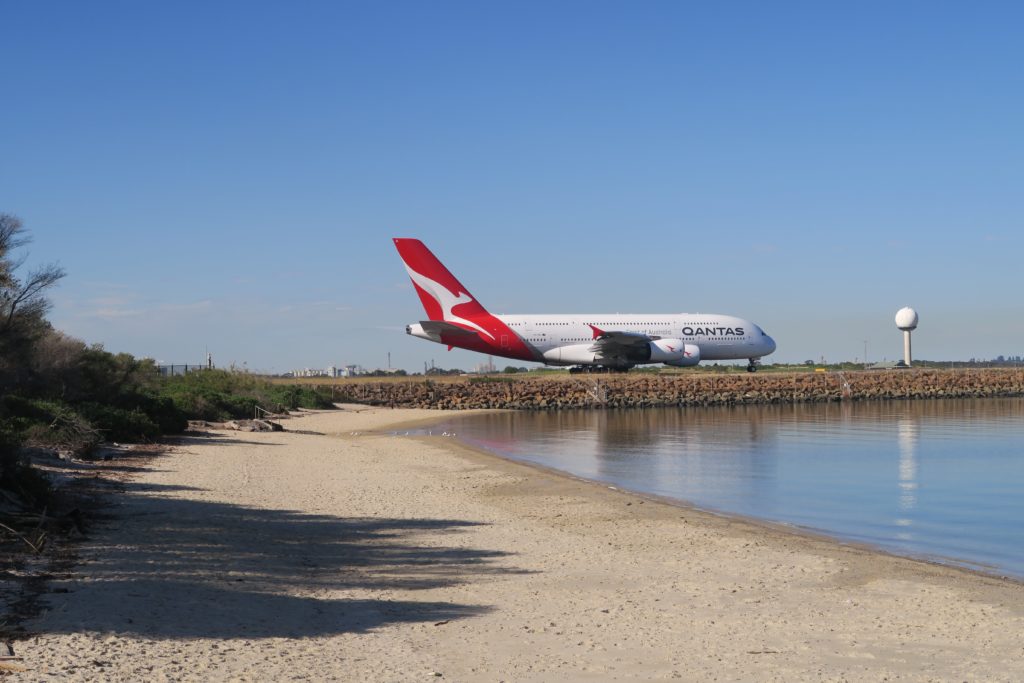 The Secluded Sydney Beach Where You Can See Planes Take Off Up Close